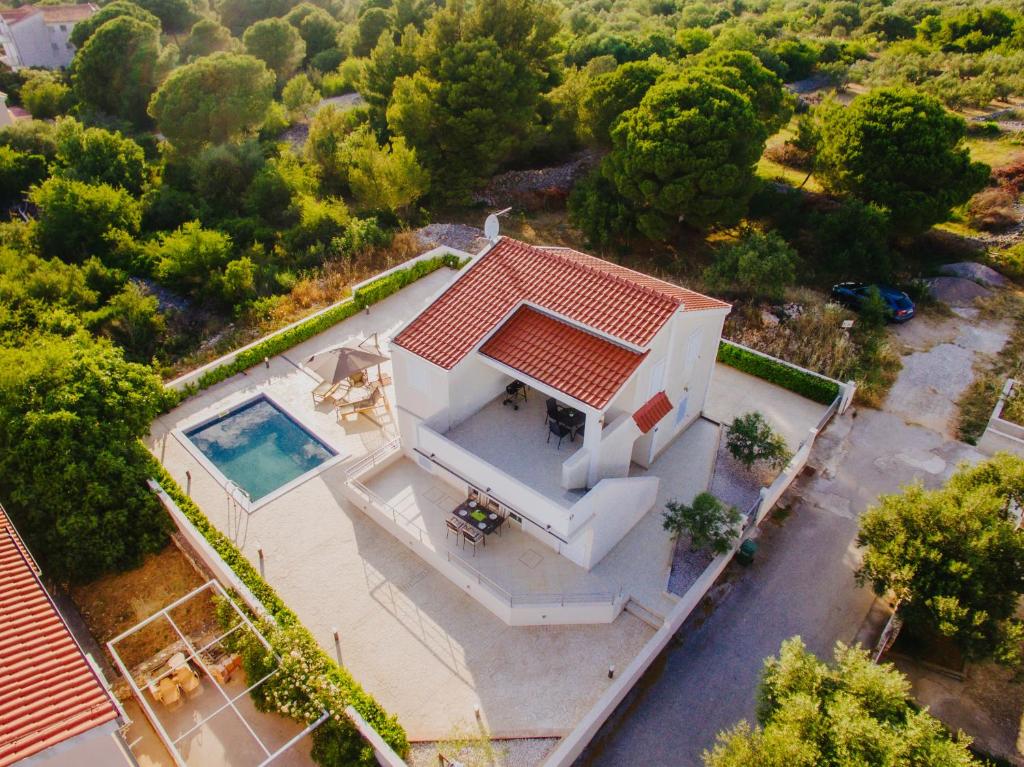 an overhead view of a house with a swimming pool at Villa Vinko in Trogir