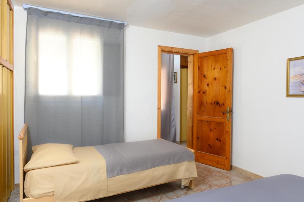 Postel nebo postele na pokoji v ubytování Salento incantevole alloggio fronte mare