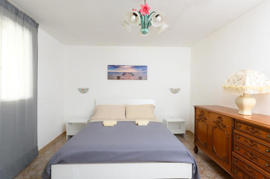 Postel nebo postele na pokoji v ubytování Salento incantevole alloggio fronte mare