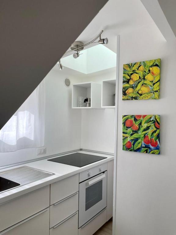 Kuchyňa alebo kuchynka v ubytovaní Virgilio 82 - Penthouse With Terrace