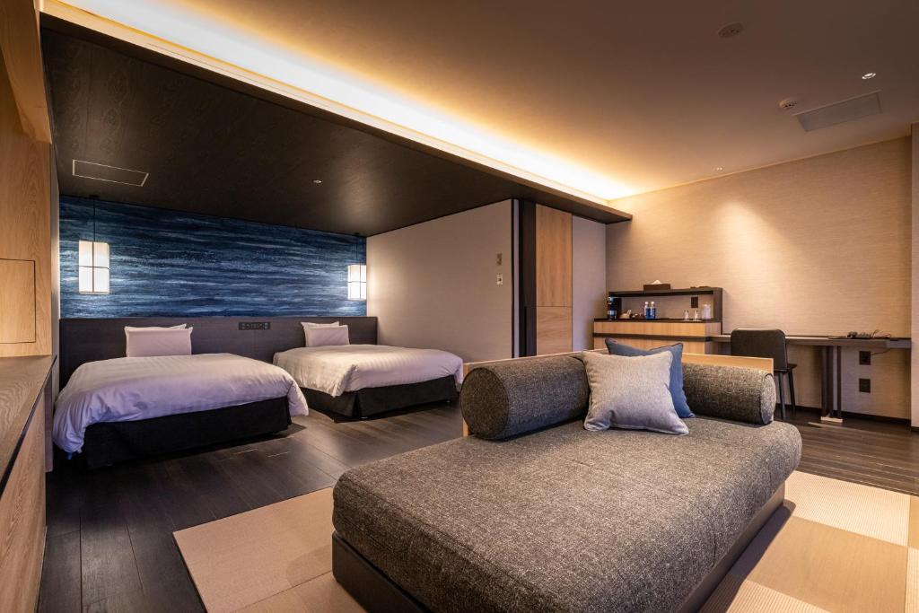Postel nebo postele na pokoji v ubytování Kirishima Kokusai Hotel