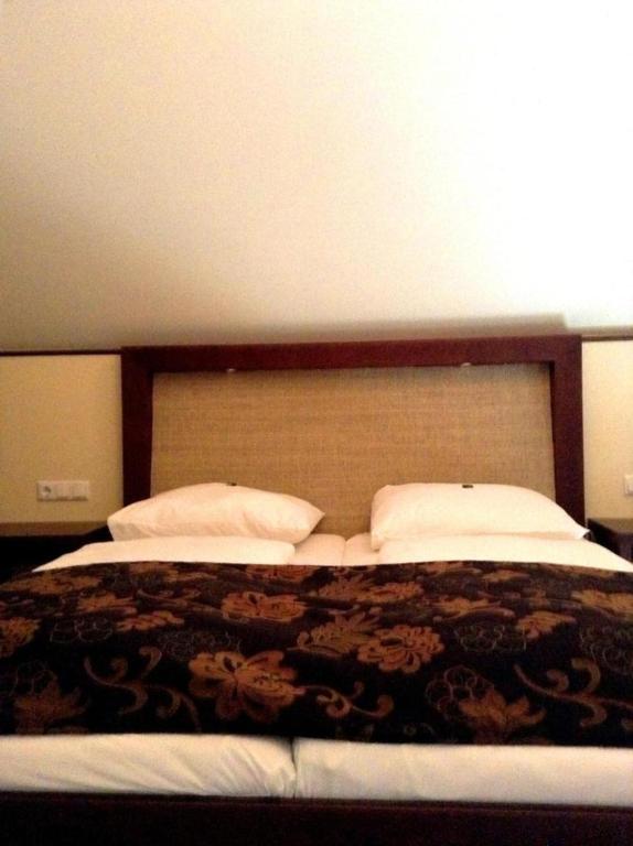 Postel nebo postele na pokoji v ubytování Gasthof & Hotel Wolfsegger