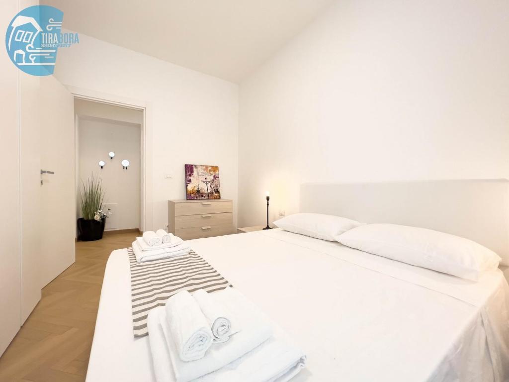 En eller flere senger på et rom på San Maurizio Tirabora Short Rent