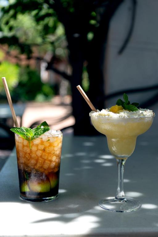 two cocktails are sitting on a table at Hotel Madreselva - Grupo Califa in Los Caños de Meca