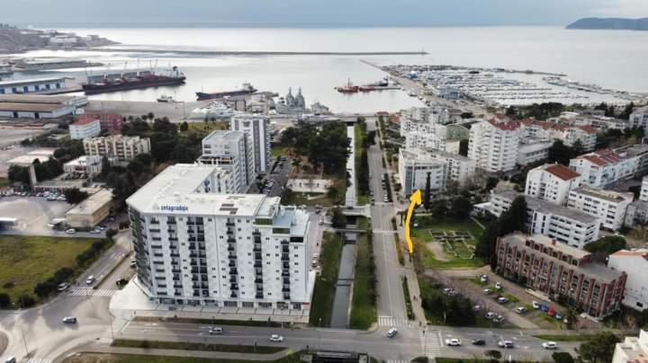 an aerial view of a city with buildings and a harbor at Апартаменты Ирина М in Bar