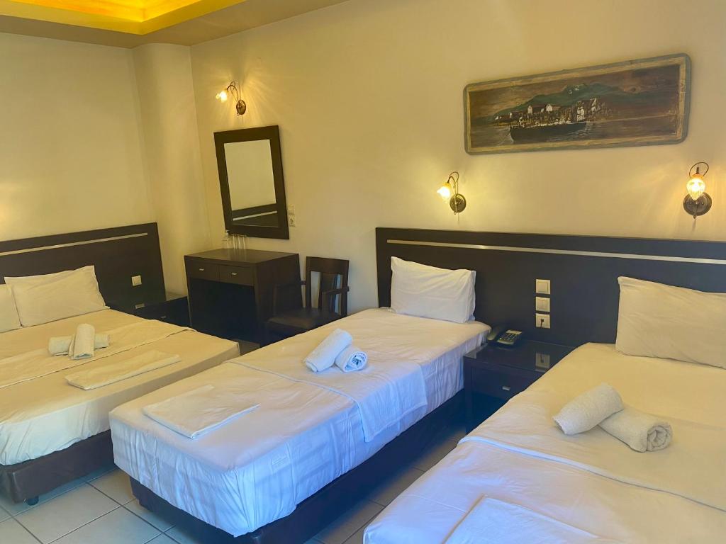 Postel nebo postele na pokoji v ubytování Hotel Alkionis