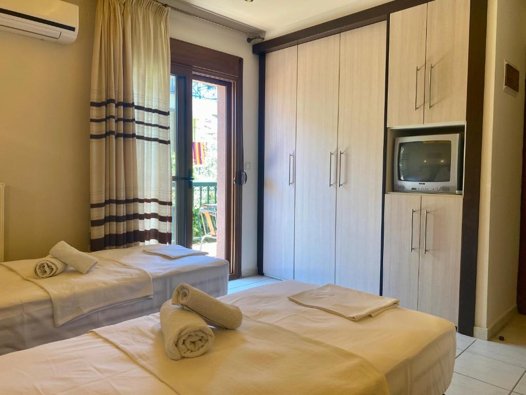 Postel nebo postele na pokoji v ubytování Hotel Alkionis