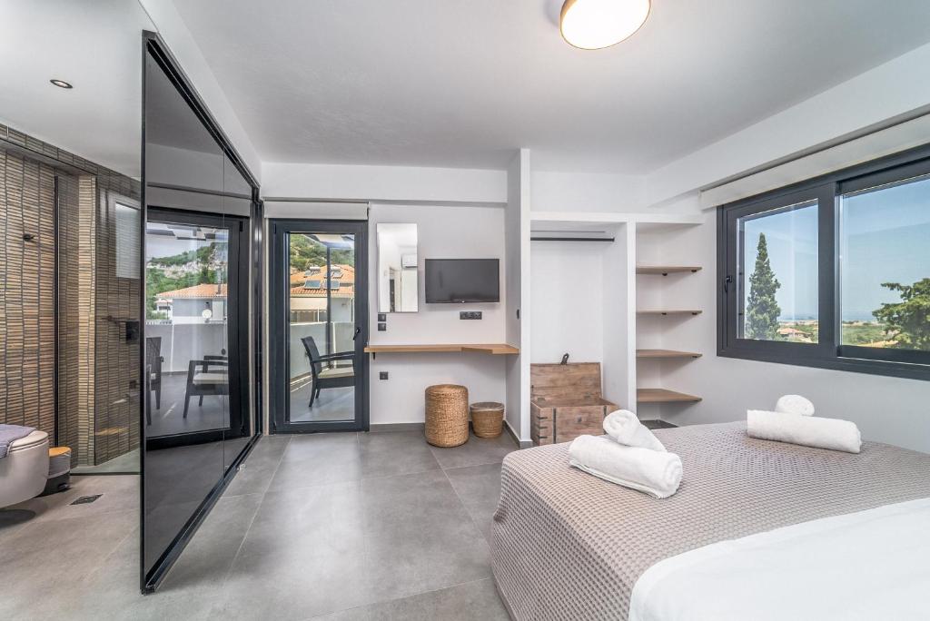 Posteľ alebo postele v izbe v ubytovaní Nemesis Luxury Villas