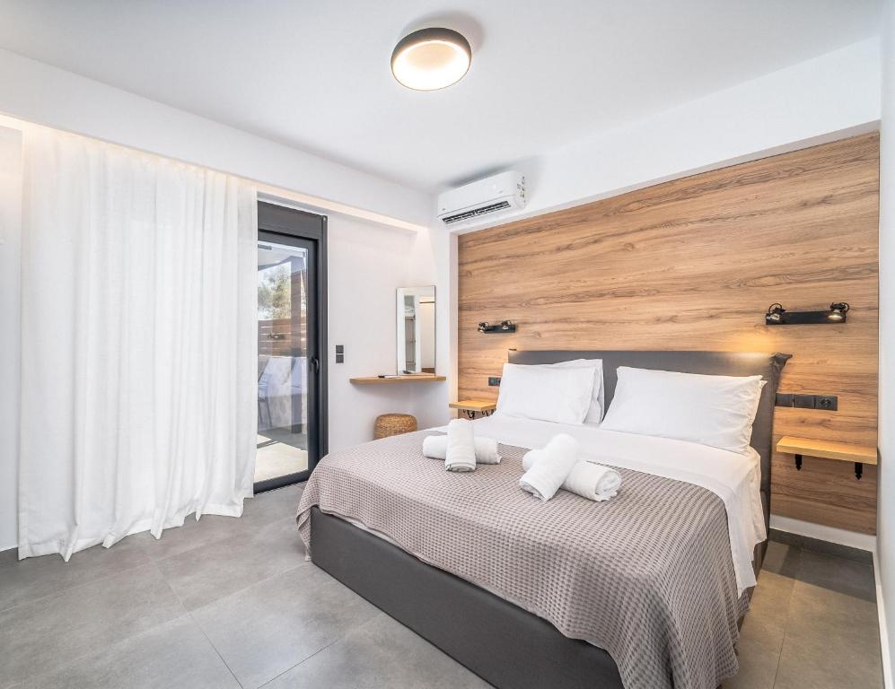 Posteľ alebo postele v izbe v ubytovaní Nemesis Luxury Villas