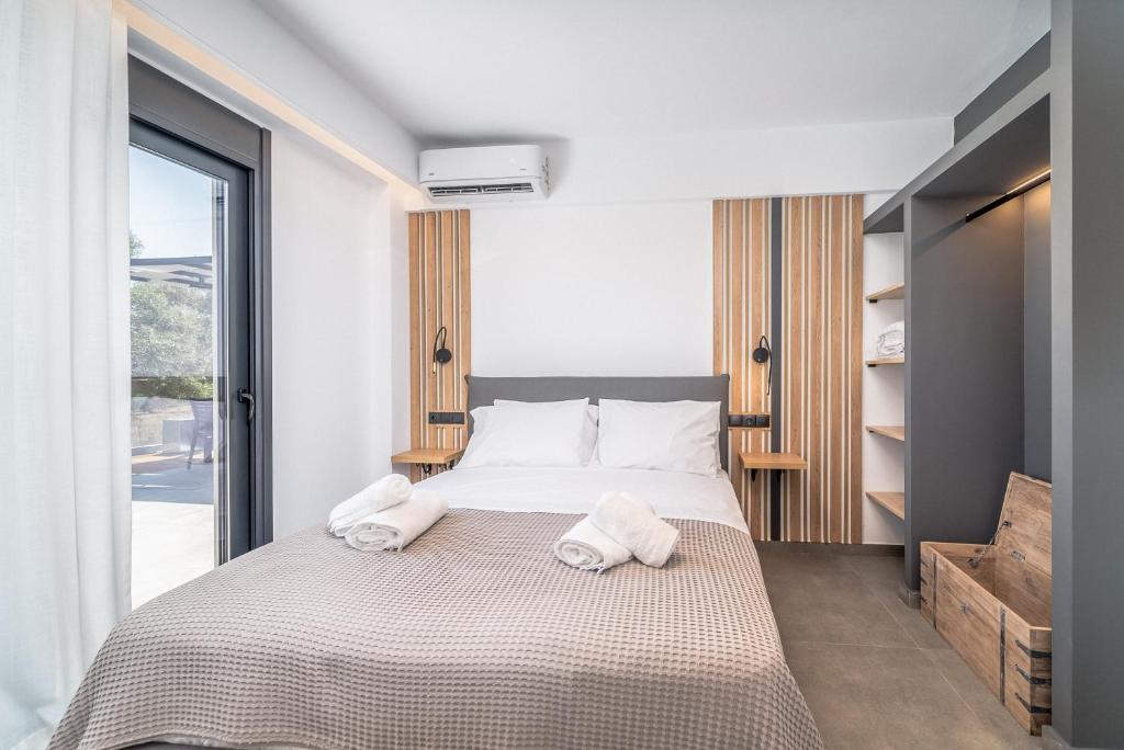 Posteľ alebo postele v izbe v ubytovaní Nemesis Luxury Villas