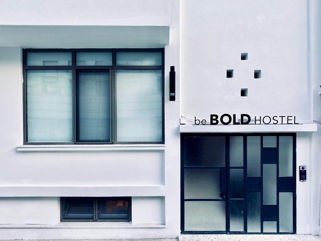 a building with a sign that reads be bold hospital at BE BOLD HOSTEL in Antalya