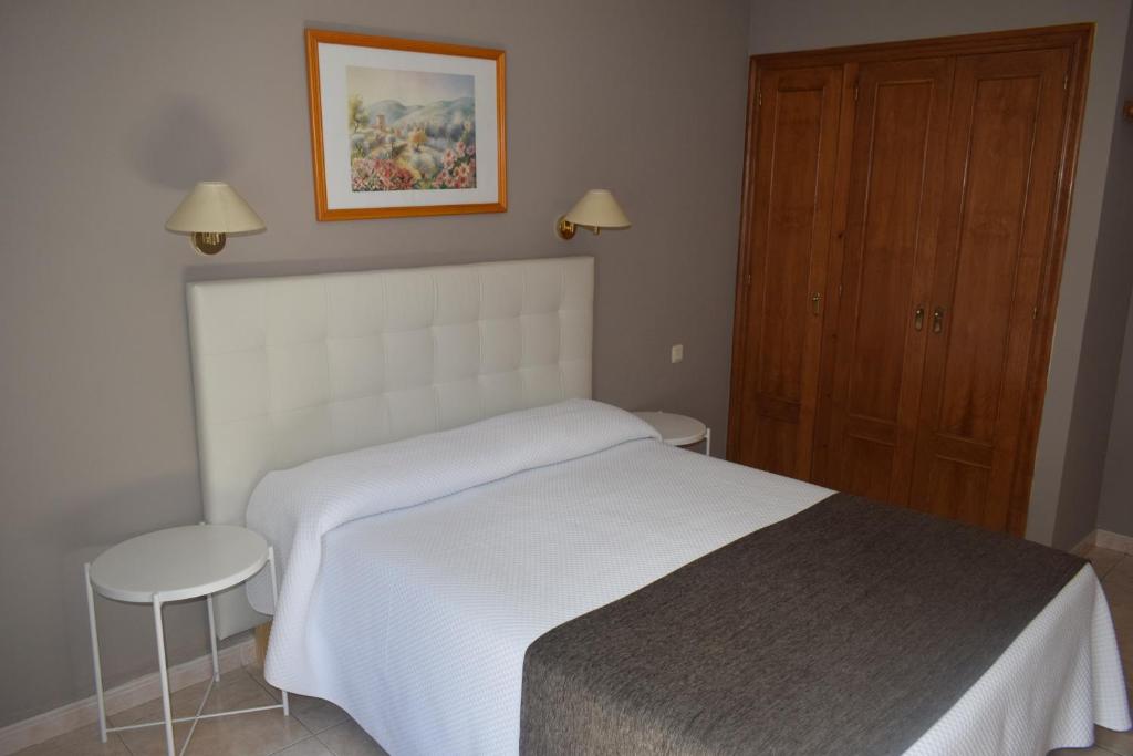 Postel nebo postele na pokoji v ubytování Hotel Juan Canejan