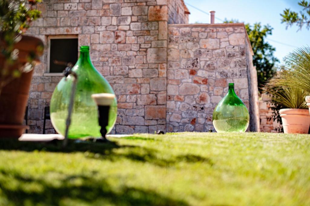 A garden outside HelloAPULIA Typical Cottage Lamia delle Murge - Private Pool & Scenic Hilltop Retreat - Pet friendly