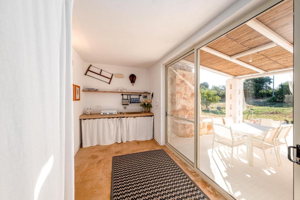 A kitchen or kitchenette at HelloAPULIA Typical Cottage Lamia delle Murge - Private Pool & Scenic Hilltop Retreat - Pet friendly