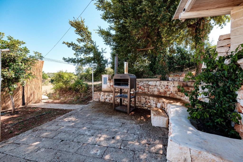 A garden outside HelloAPULIA Typical Cottage Lamia delle Murge - Private Pool & Scenic Hilltop Retreat - Pet friendly