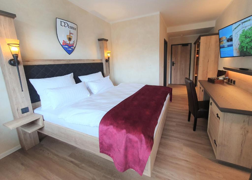 Postel nebo postele na pokoji v ubytování R&R Hotel Störtebeker
