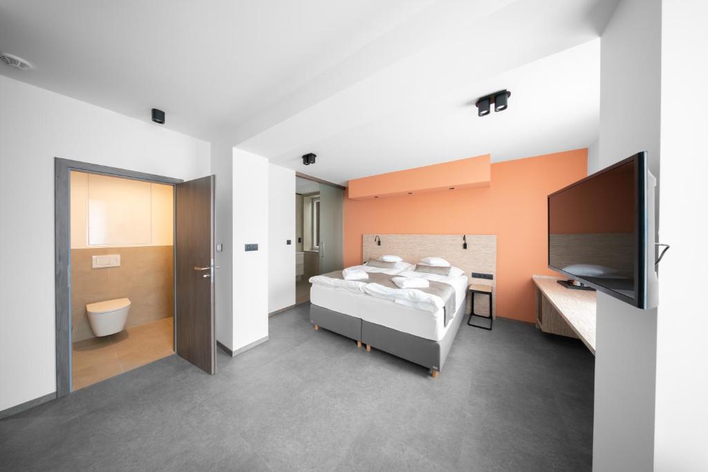 Postel nebo postele na pokoji v ubytování Hotel Diana