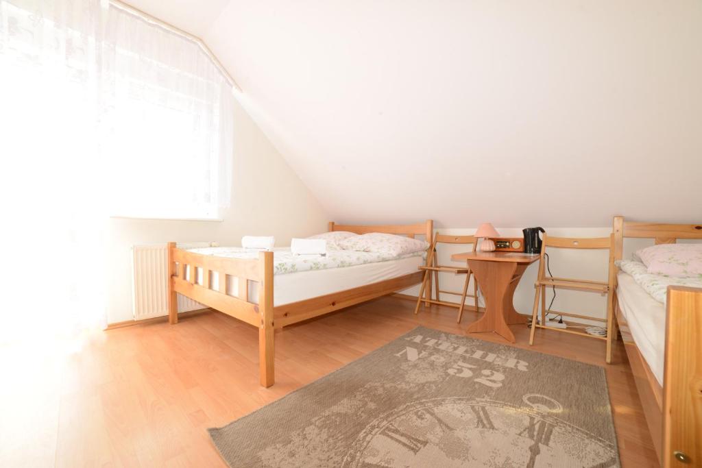 Postel nebo postele na pokoji v ubytování Dom Gościnny Piotr
