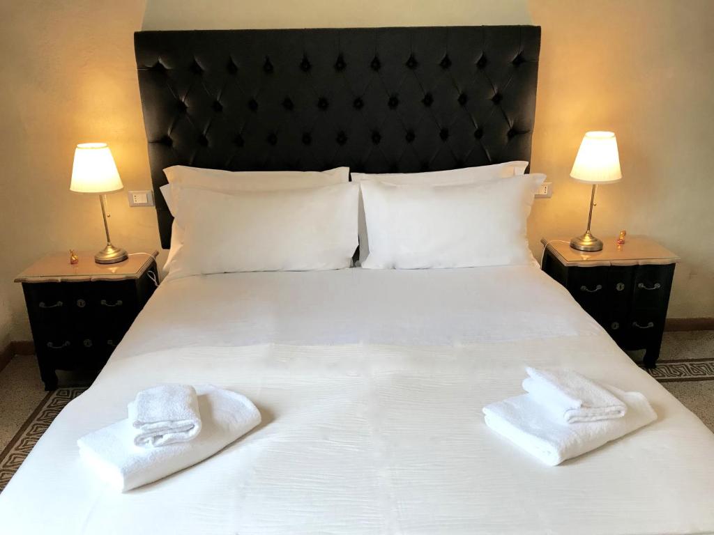 Posteľ alebo postele v izbe v ubytovaní Guest House Le Contesse