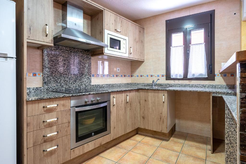 Kuchyň nebo kuchyňský kout v ubytování Hauzify I Casa Sant Gregori