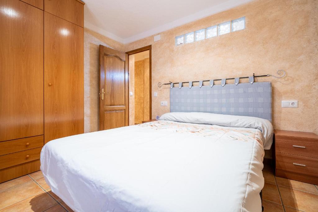 Postel nebo postele na pokoji v ubytování Hauzify I Casa Sant Gregori
