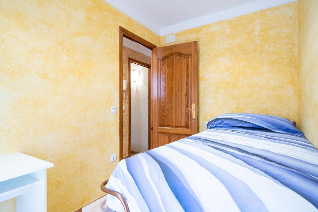 Postel nebo postele na pokoji v ubytování Hauzify I Casa Sant Gregori