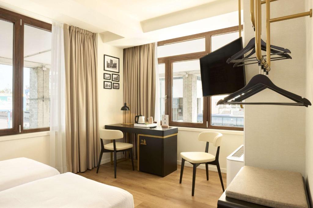 TV a/nebo společenská místnost v ubytování Best Western Hotel Tritone