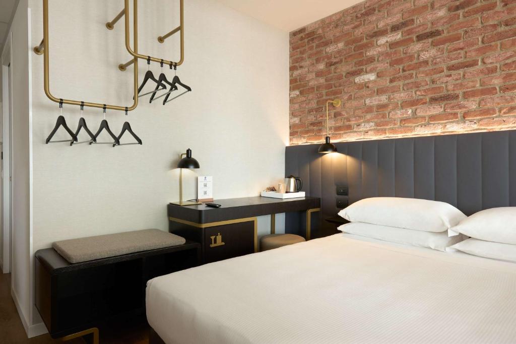 Postel nebo postele na pokoji v ubytování Best Western Hotel Tritone