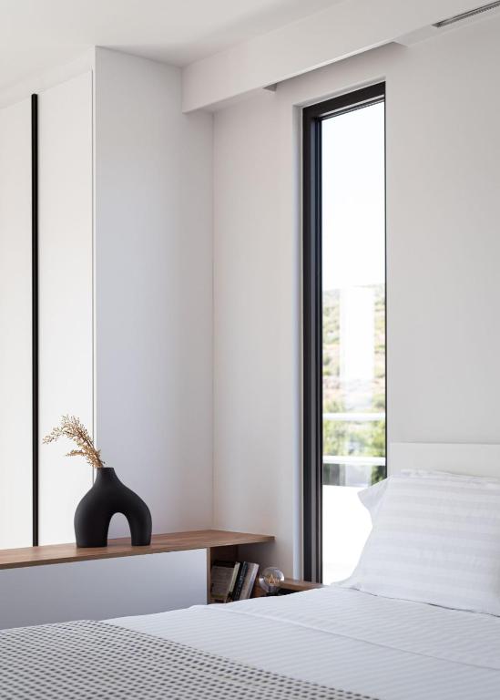 Postel nebo postele na pokoji v ubytování Sounio Panoramic Loft