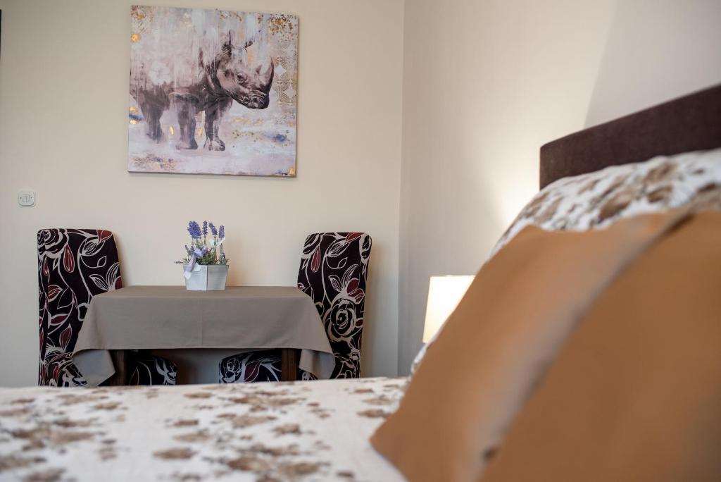 Postel nebo postele na pokoji v ubytování Apartmani Tome