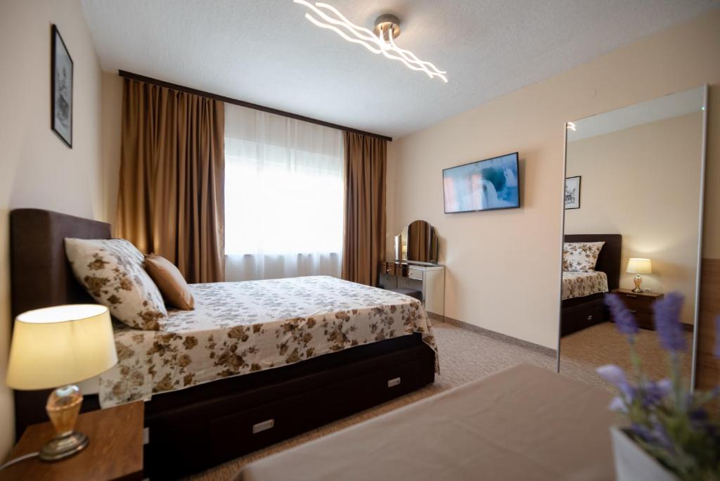 Postel nebo postele na pokoji v ubytování Apartmani Tome