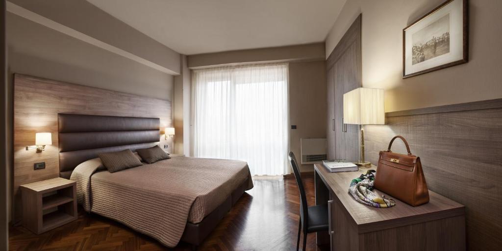 Postel nebo postele na pokoji v ubytování Hotel San Giorgio
