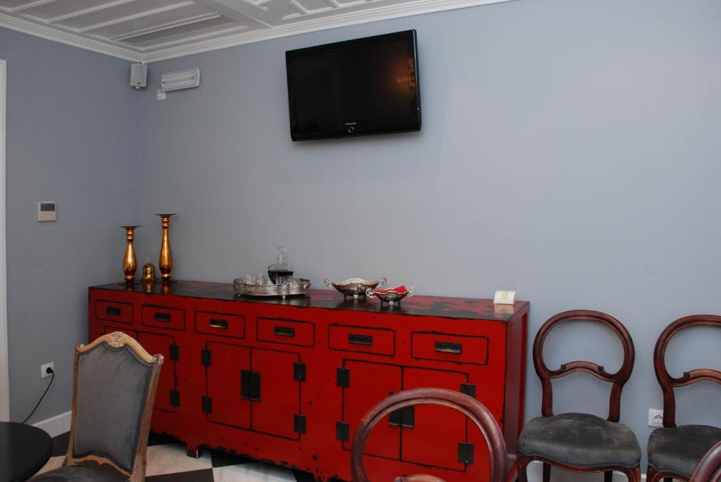 TV a/nebo společenská místnost v ubytování il Palazzo Rooms & Suites