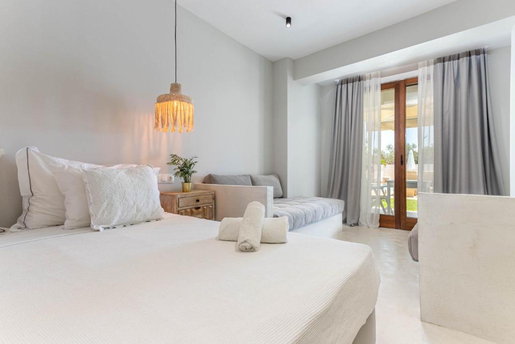 Voodi või voodid majutusasutuse Hesperides Hotel Pefkochori toas
