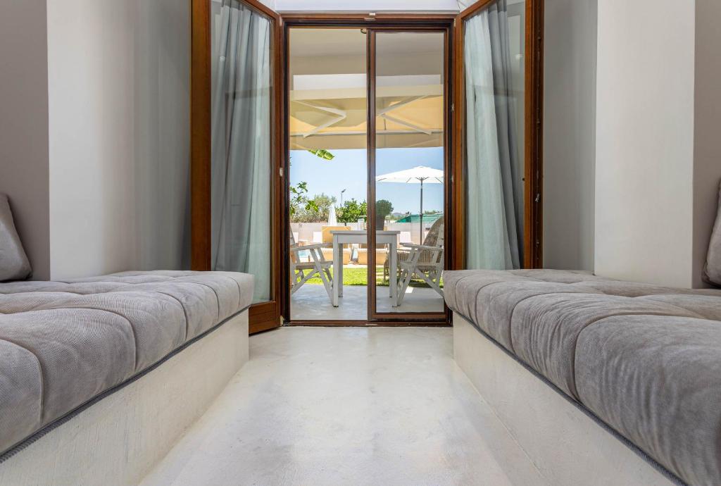 Voodi või voodid majutusasutuse Hesperides Hotel Pefkochori toas