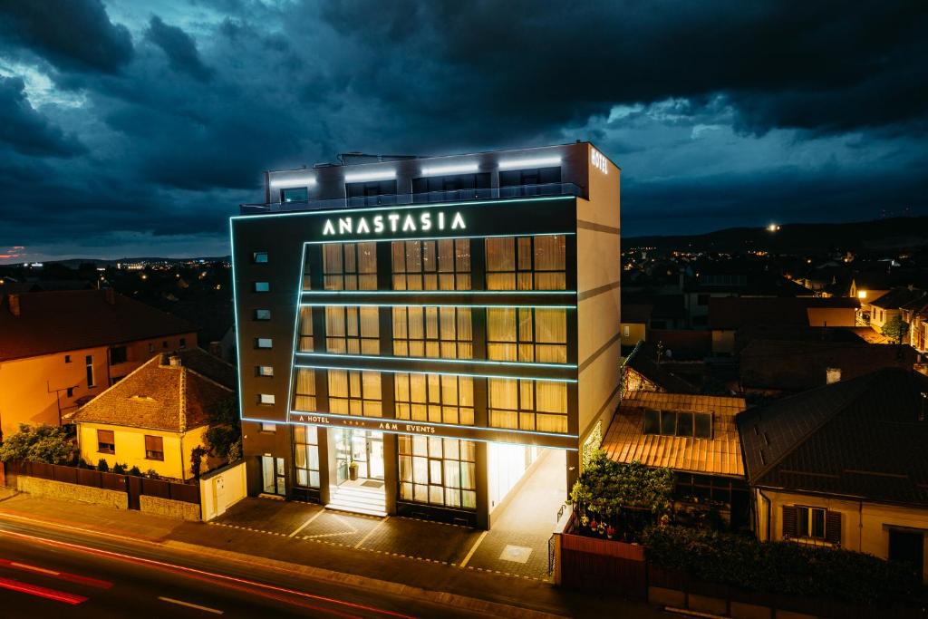 a building with aaniaania sign on the side of it at Hotel Anastasia in Sibiu