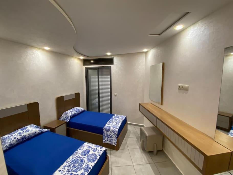 Postel nebo postele na pokoji v ubytování Luxueux appartement avec vue sur mer à Martil