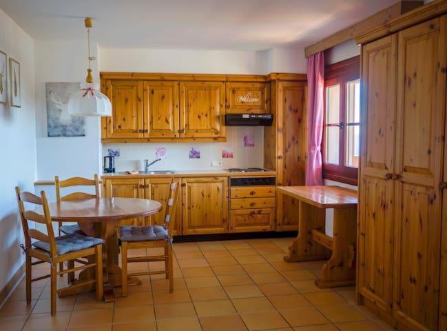A kitchen or kitchenette at LivGood Appartements Gerlitzen