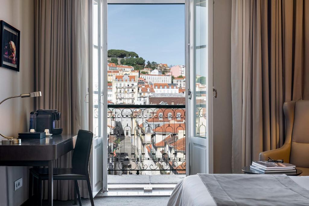 Cama ou camas em um quarto em Hotel do Chiado