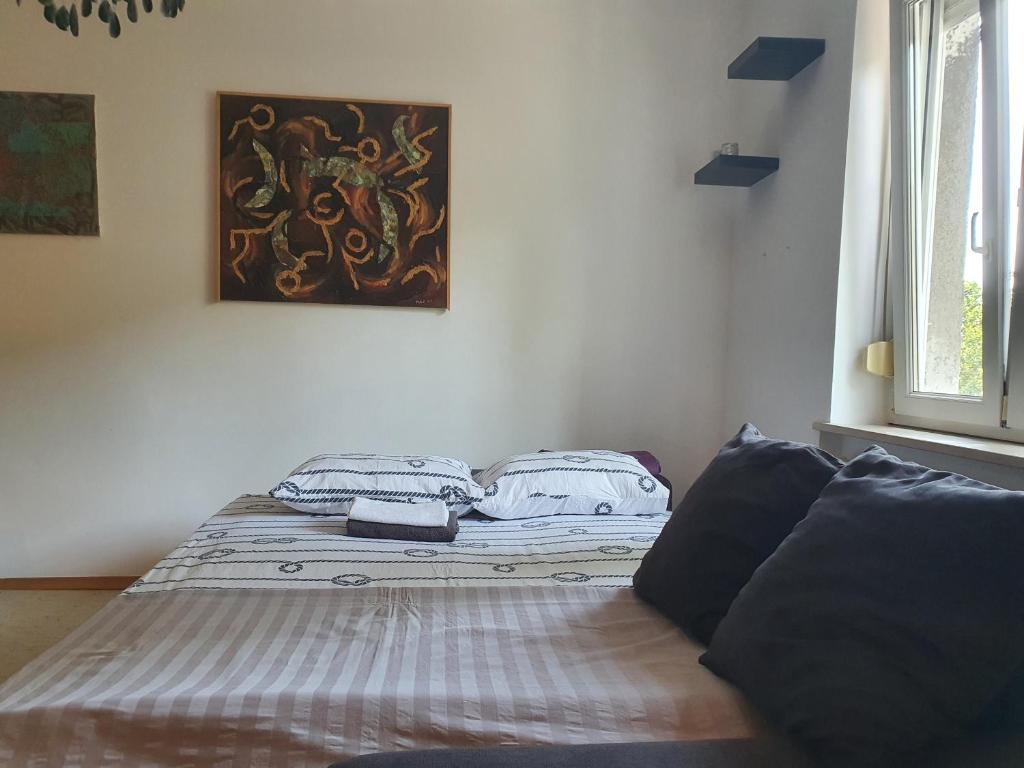 Posteľ alebo postele v izbe v ubytovaní Downtown Oasis Zagreb
