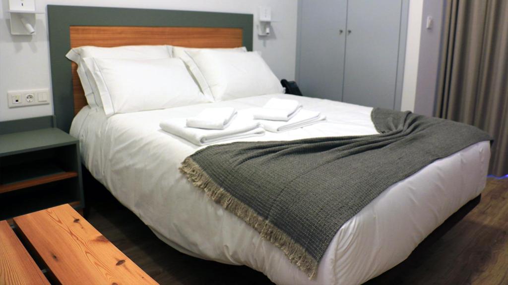 Postel nebo postele na pokoji v ubytování Aliança café & hostel