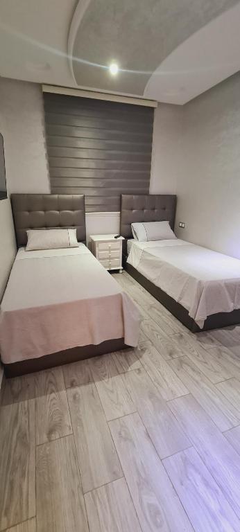 Postel nebo postele na pokoji v ubytování Apartamientos edificio mekad