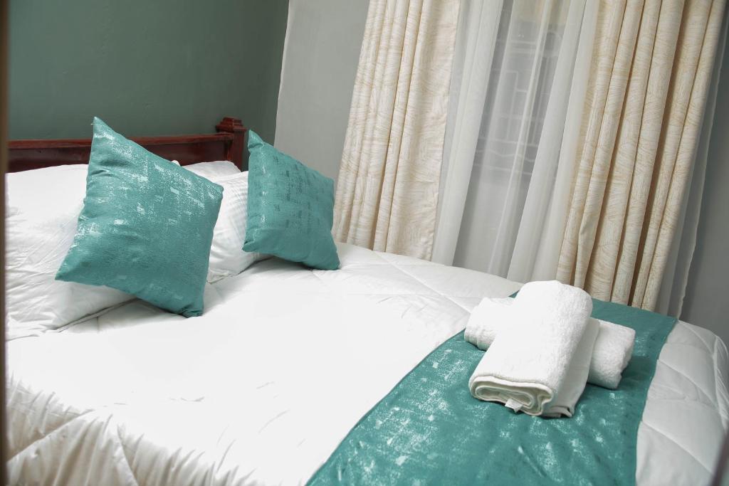 Postel nebo postele na pokoji v ubytování Parkview apartments