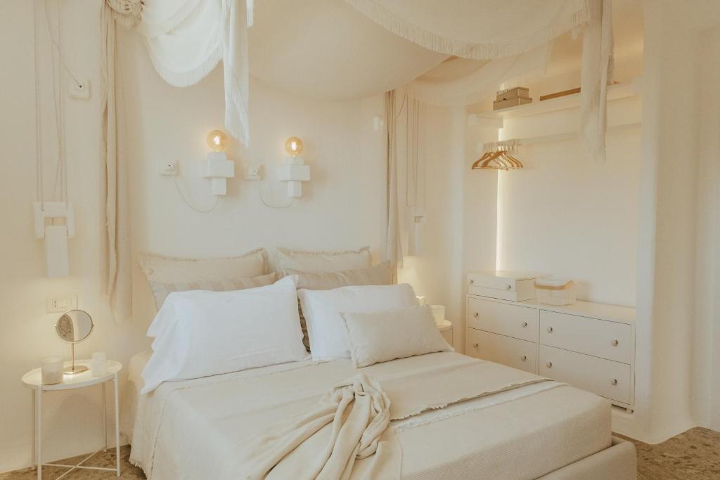 Postel nebo postele na pokoji v ubytování Masseria Borgo Ritella