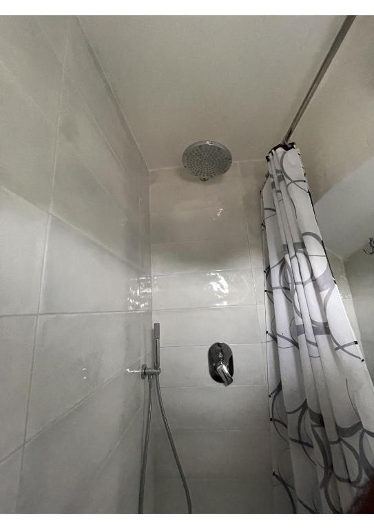 a shower with a shower curtain in a bathroom at Amalfi Coast Casa Ida in Vietri sul Mare