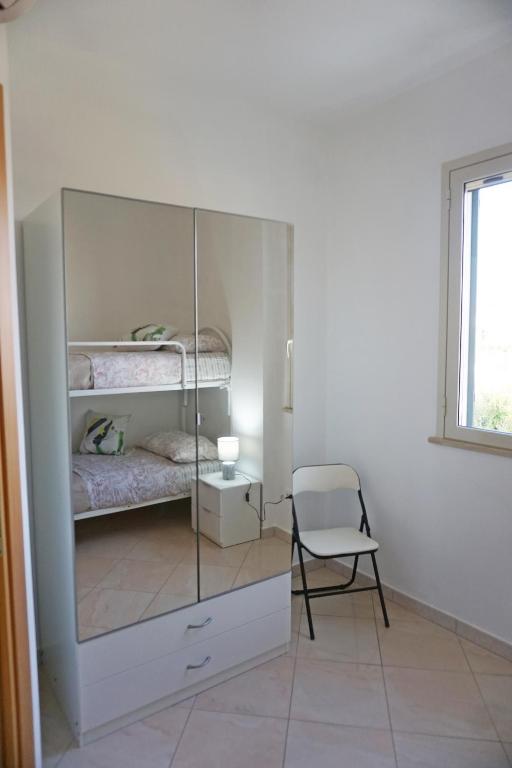 Postel nebo postele na pokoji v ubytování Holiday House Villa AleGiù Marzamemi