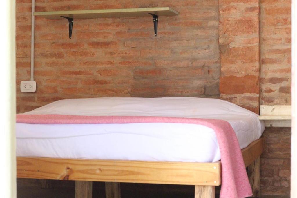 Postel nebo postele na pokoji v ubytování Cielito Lindo