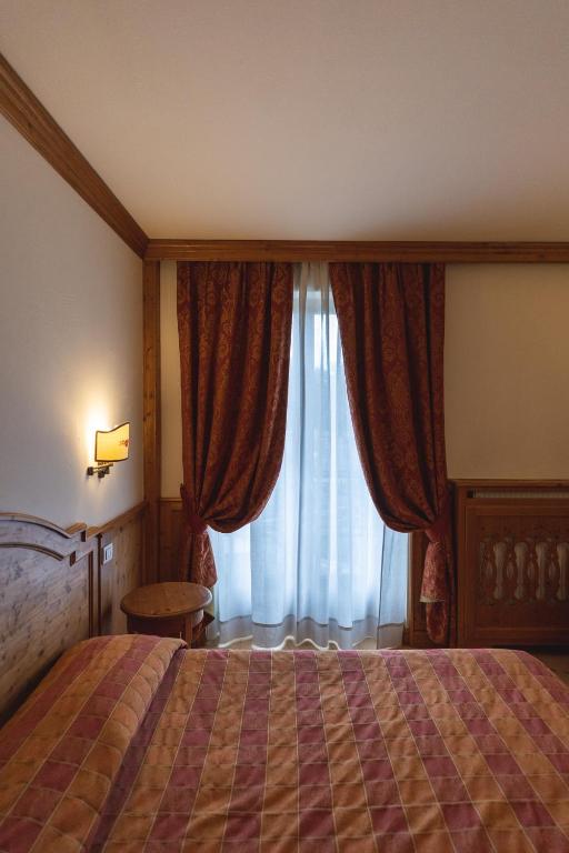 Postel nebo postele na pokoji v ubytování Hotel Europa Residence