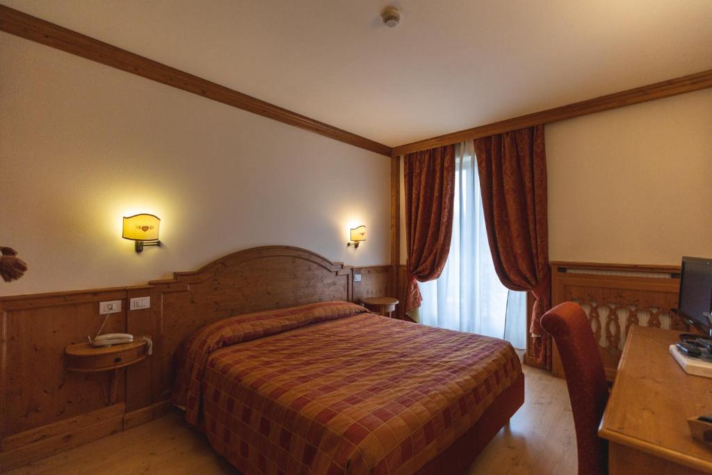 Postel nebo postele na pokoji v ubytování Hotel Europa Residence