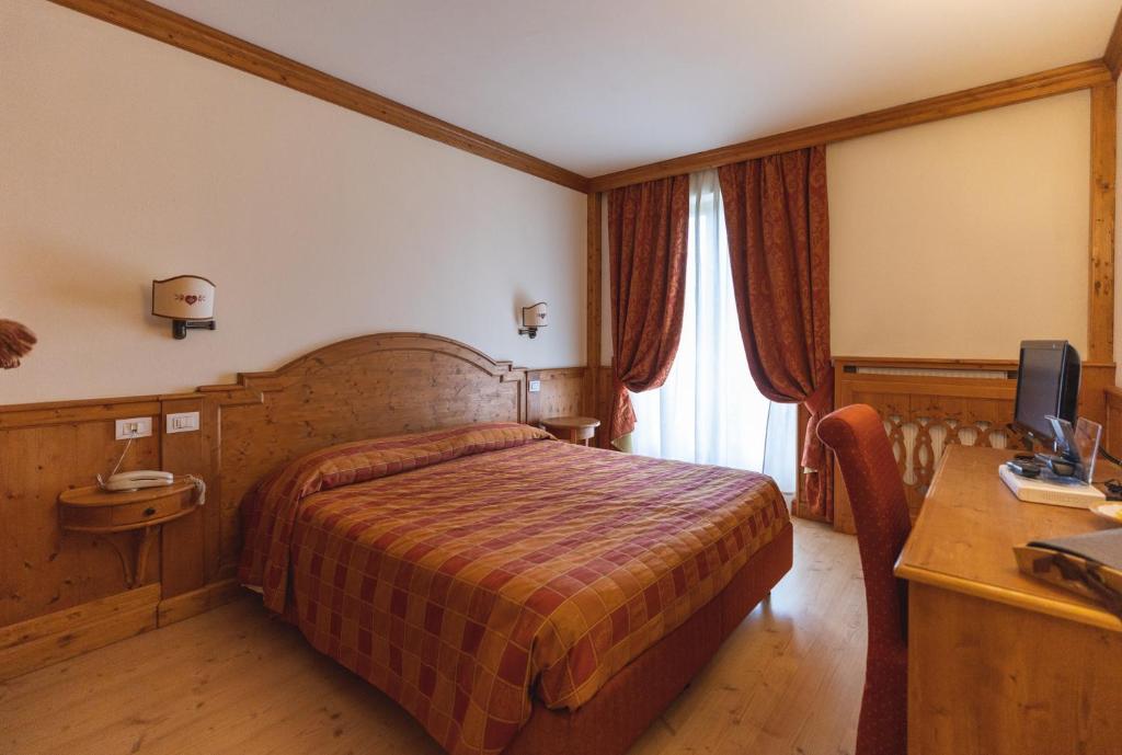 Postel nebo postele na pokoji v ubytování Hotel Europa Residence